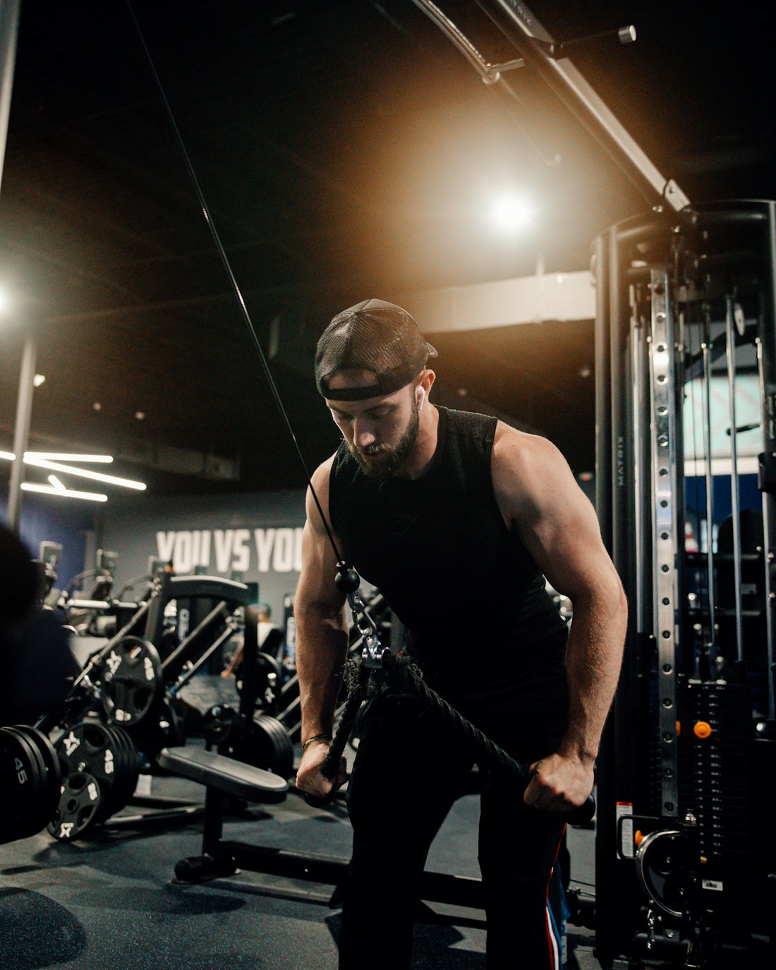 a man working out with a rope in a gym